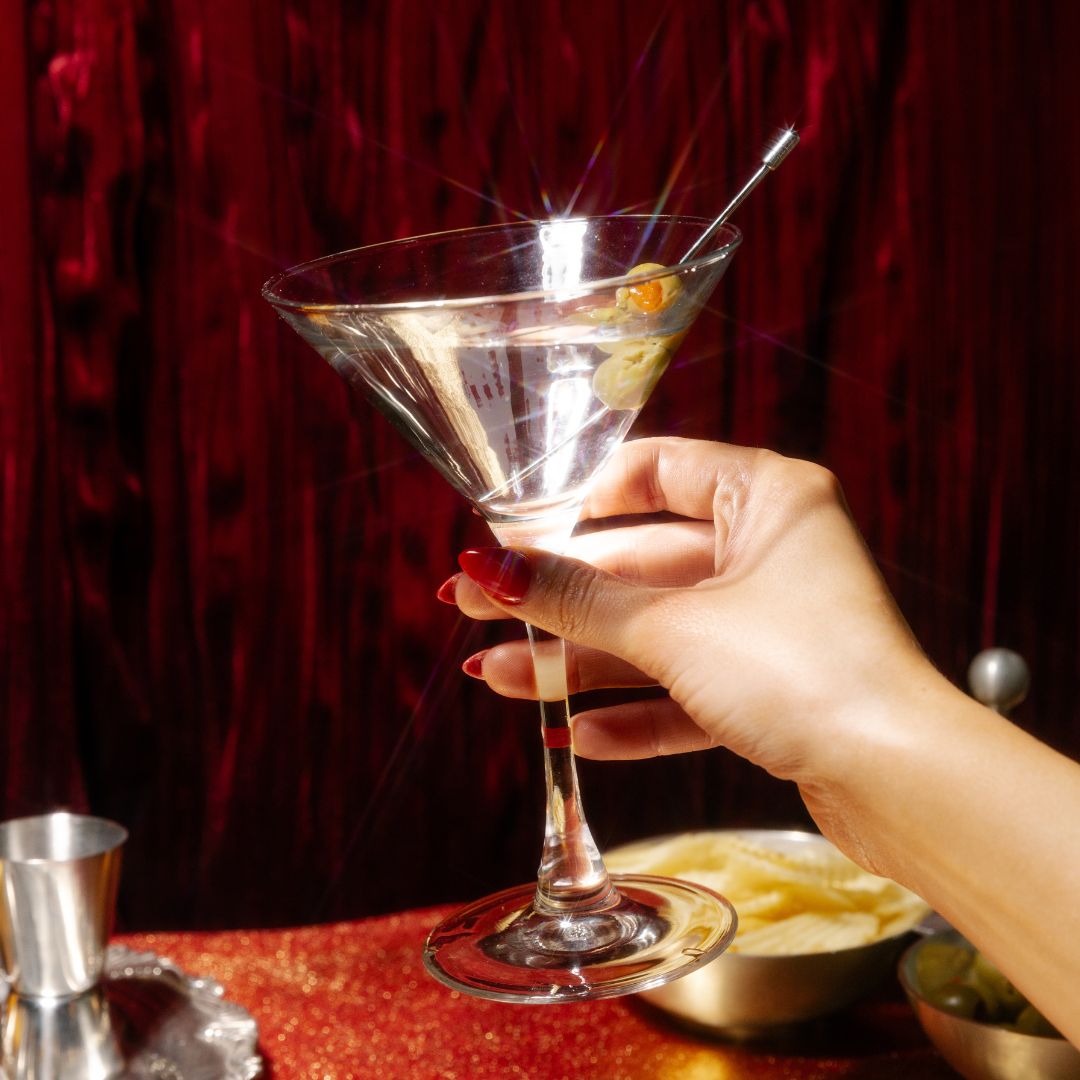 woman holding martini