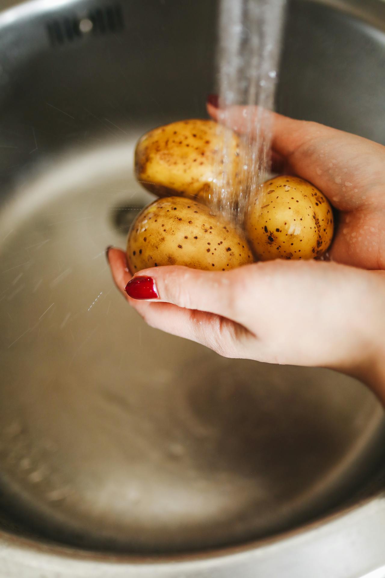 washing potatoes